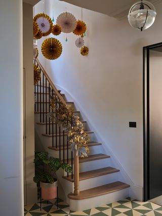 staircase with hanging christmas decorations