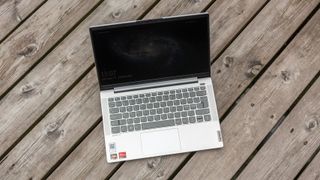 Lenovo IdeaPad 5 14-inch sitting on a wooden patio