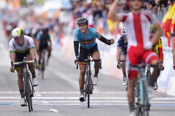 Michal Kwiatkowski (Poland) celebrates while Greg Van Avermaet (Belgium) curses