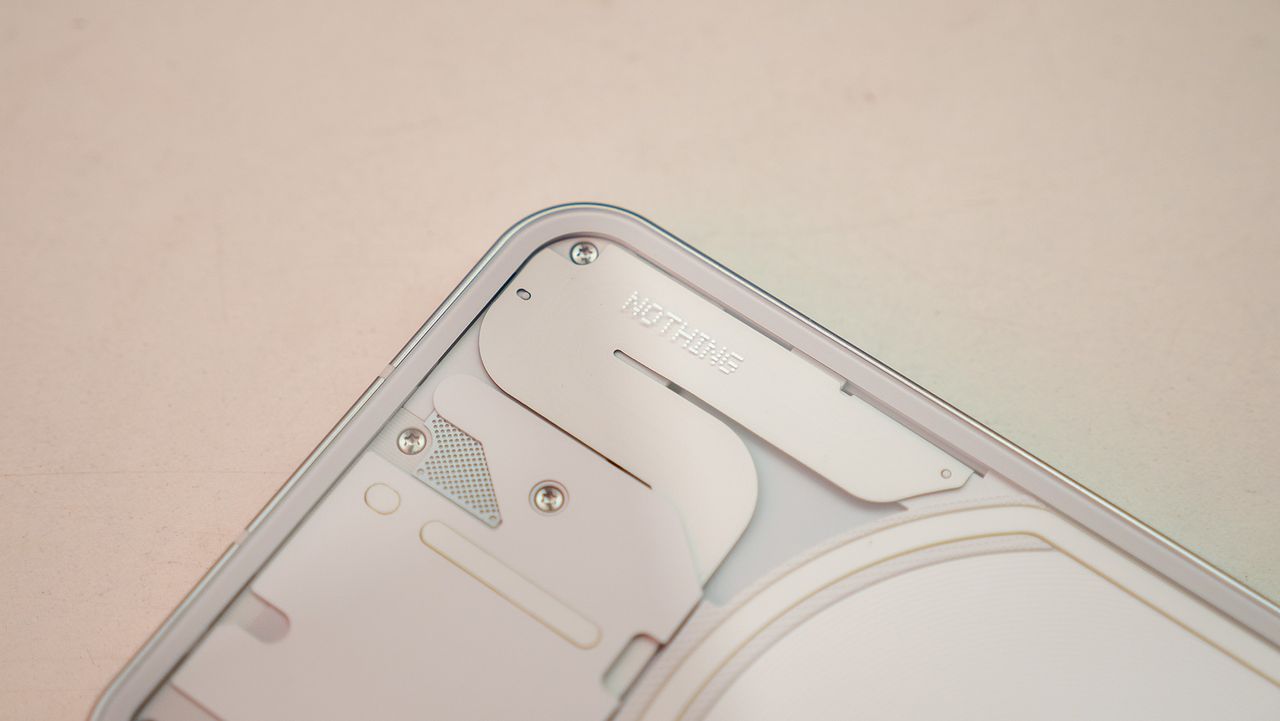 Nothing phone (1) close-up of the electronics behind the phone's transparent back