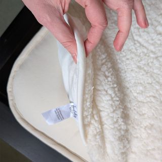 The Dunelm Teddy Mattress Topper being tested in a bedroom