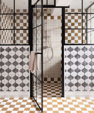 A shower room decorated with checkered tiles