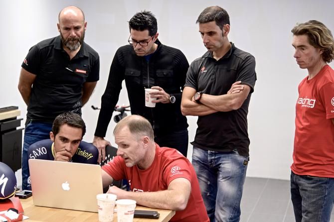 Food for thought as Contador and his brother (back row, centre) look over the data