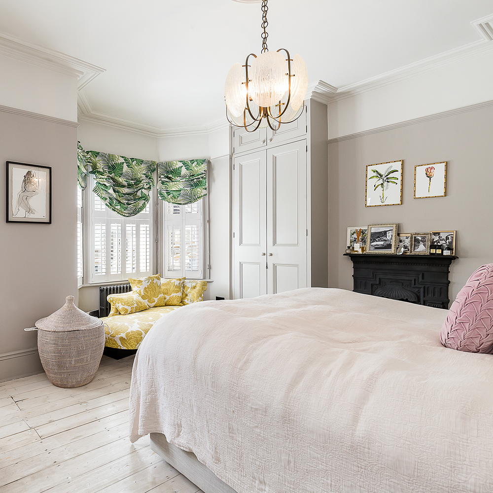 bedroom with grey wall and yellow couch