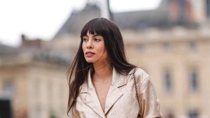 lamellar water - Fer Millan wears a golden shiny full look, a jacket with gathered sleeves, a belt, a Chanel bag, outside Chanel, during the Womenswear Fall/Winter 2024/2025 as part of Paris Fashion Week on March 05, 2024 in Paris, France 2070635647