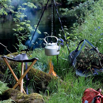 garden area with tea pot and fire with grass