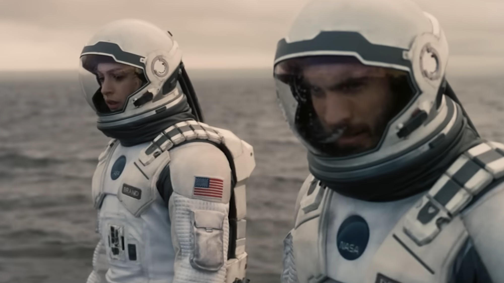 Matthew McConaughey and Anne Hathaway on a water planet in Interstellar