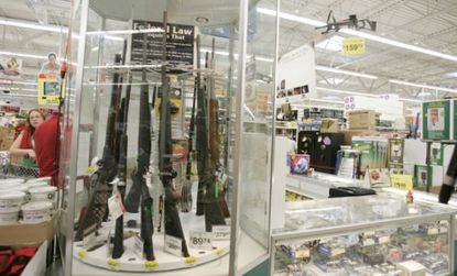 A 2004 Walmart gun display: After limiting its sales of firearms to a third of its outlets, the super chain is bringing back shotguns, hunting rifles, and bullets to 500 more stores.
