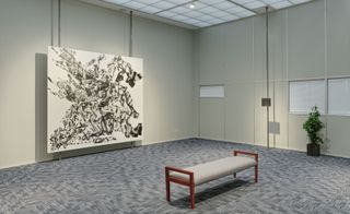 ‘Avery Singer: Free Fall’ at Hauser & Wirth, London, installation view of artworks amid office set
