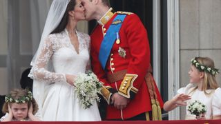 Prince William and Kate Middleton kiss on the Buckingham Palace balcony