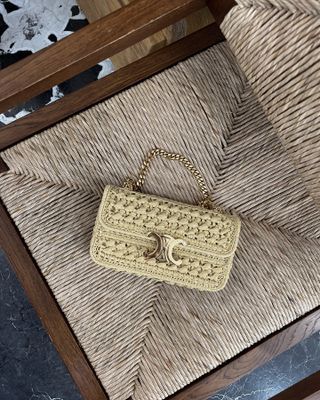 @thefashionbugblog photo of Celine raffia shoulder bag on chair.