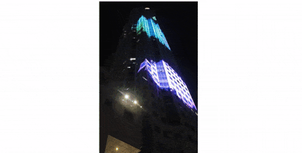 The UOB Plaza in Singapore with a colorful, record-setting, projection mapping show going on. 