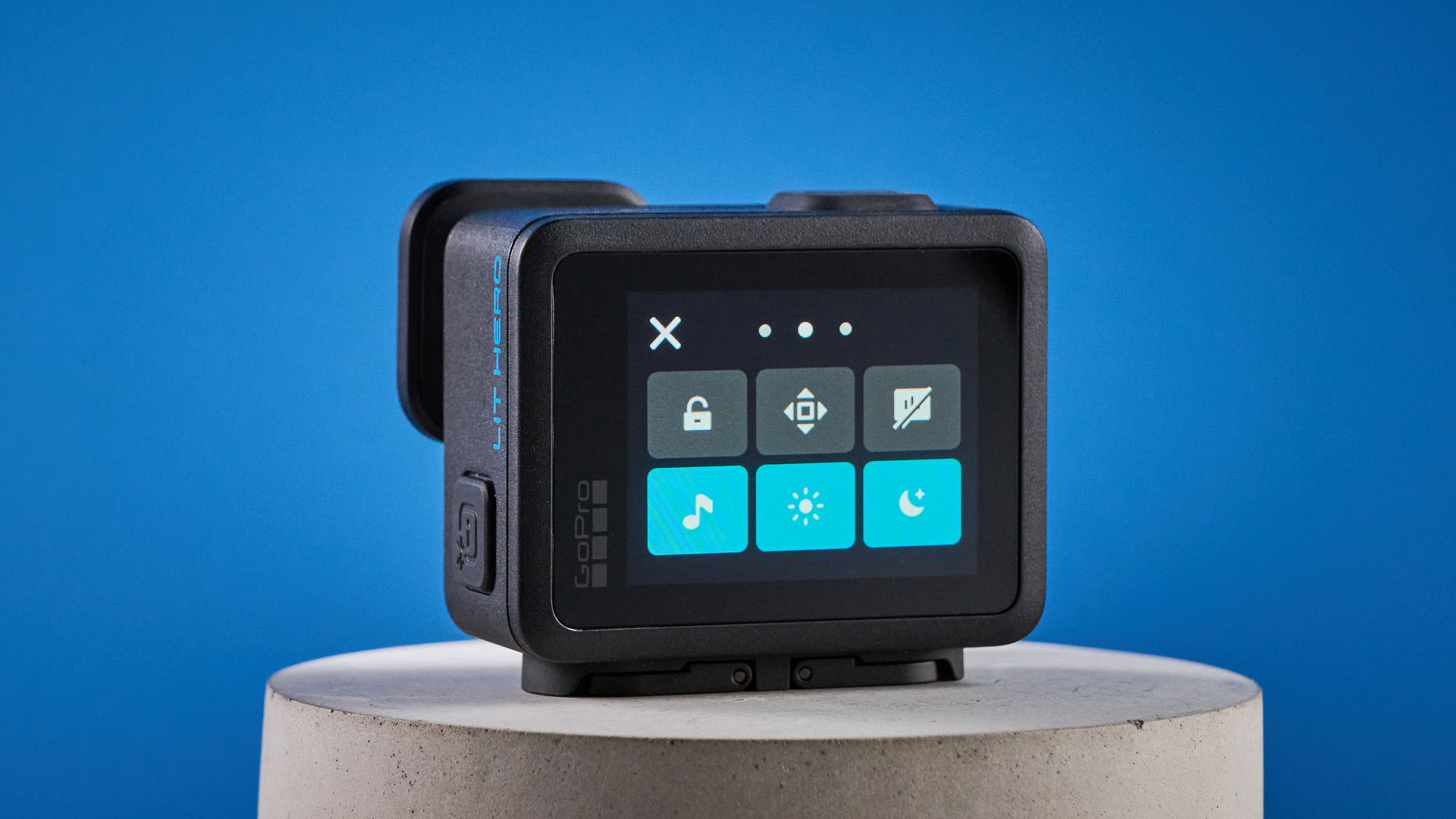 The GoPro LIT Hero against a blue background
