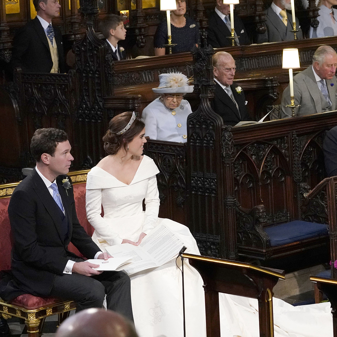 WINDSOR, ENGLAND - OCTOBER 12: Princess Eugenie and her husband Jack Brooksbank, look back towards the Duke of York and Sarah, Duchess of York (seated front) and Queen Elizabeth II, the Duke of Edinburgh, Prince of Wales, the Duke and Duchess of Cambridge, and the Duke and Duchess of Sussex, during their wedding at St George&#039;s Chapel in Windsor Castle on October 12, 2018 in Windsor, England. (Photo by Danny Lawson - WPA Pool/Getty Images)