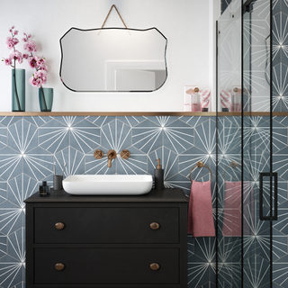 bathroom with hexagonal tiles flooring and cabinet