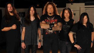 Testament posing for a photograph in 2011