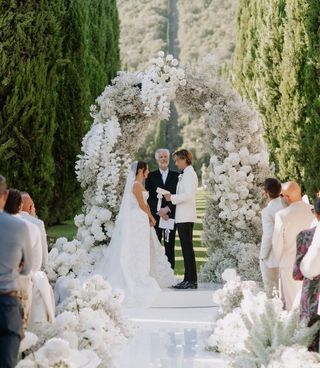 Millie Bobby Brown stands at the altar at her wedding to Jake Bongiovi in Italy