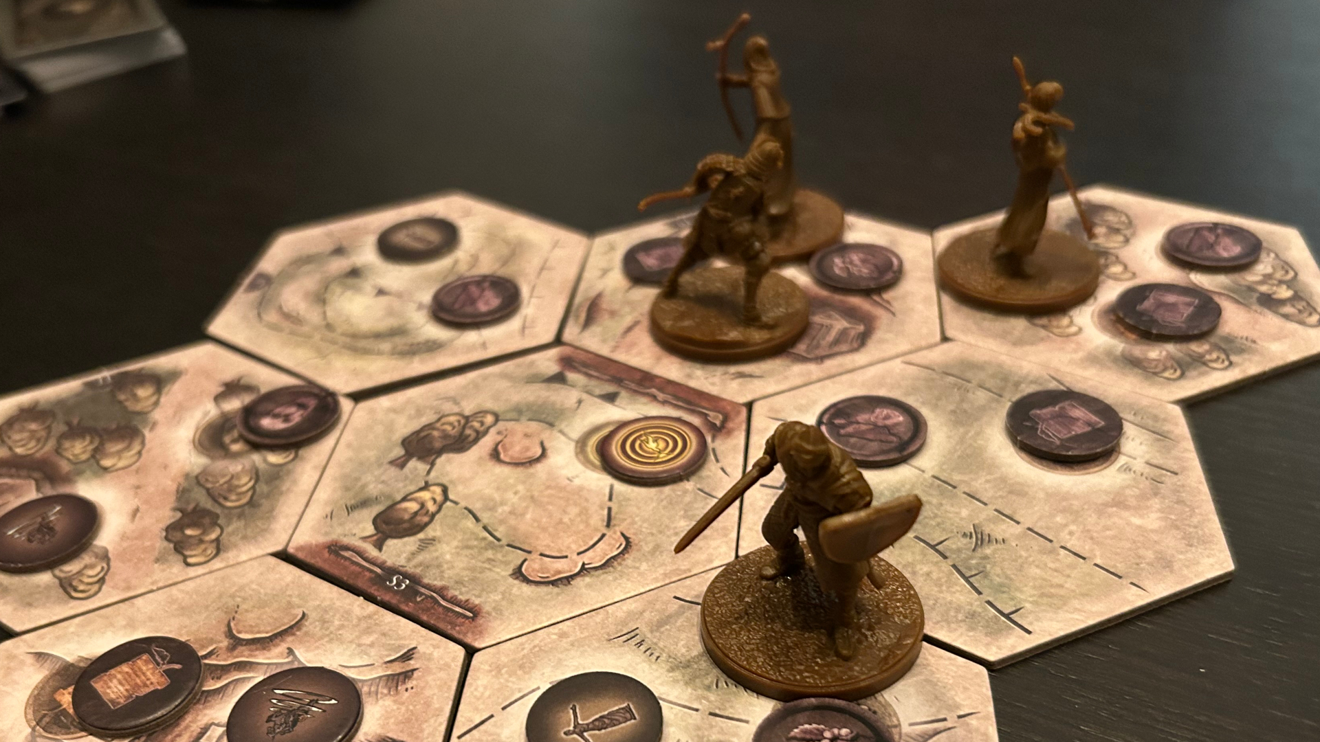 Elden Ring board game miniatures on tiles, with tokens scattered around