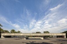 Mube museum facade in Brazil, raw concrete under blue skies