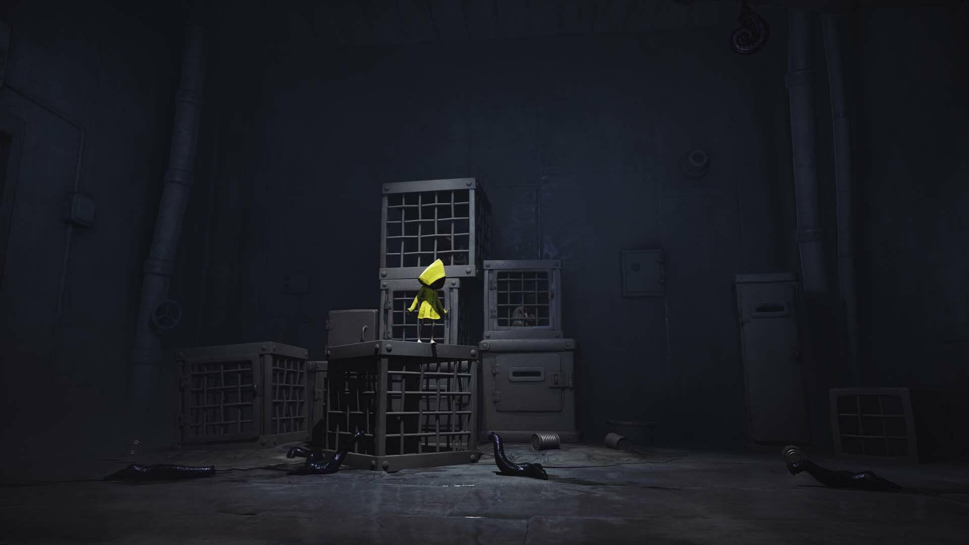 Little Nightmares Enhanced screenshot showing Six, who wears a yellow raincoat, standing on a pile of stacked cages