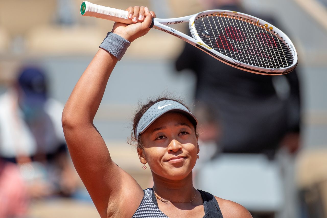 Naomi Osaka of Japan celebrates her victory against Patricia Maria Tig of Romania in the first round of the Women&#039;s Singles competition on Court Philippe-Chatrier at the 2021 French Open Tennis Tournament at Roland Garros on May 30th 2021 in Paris, France. 