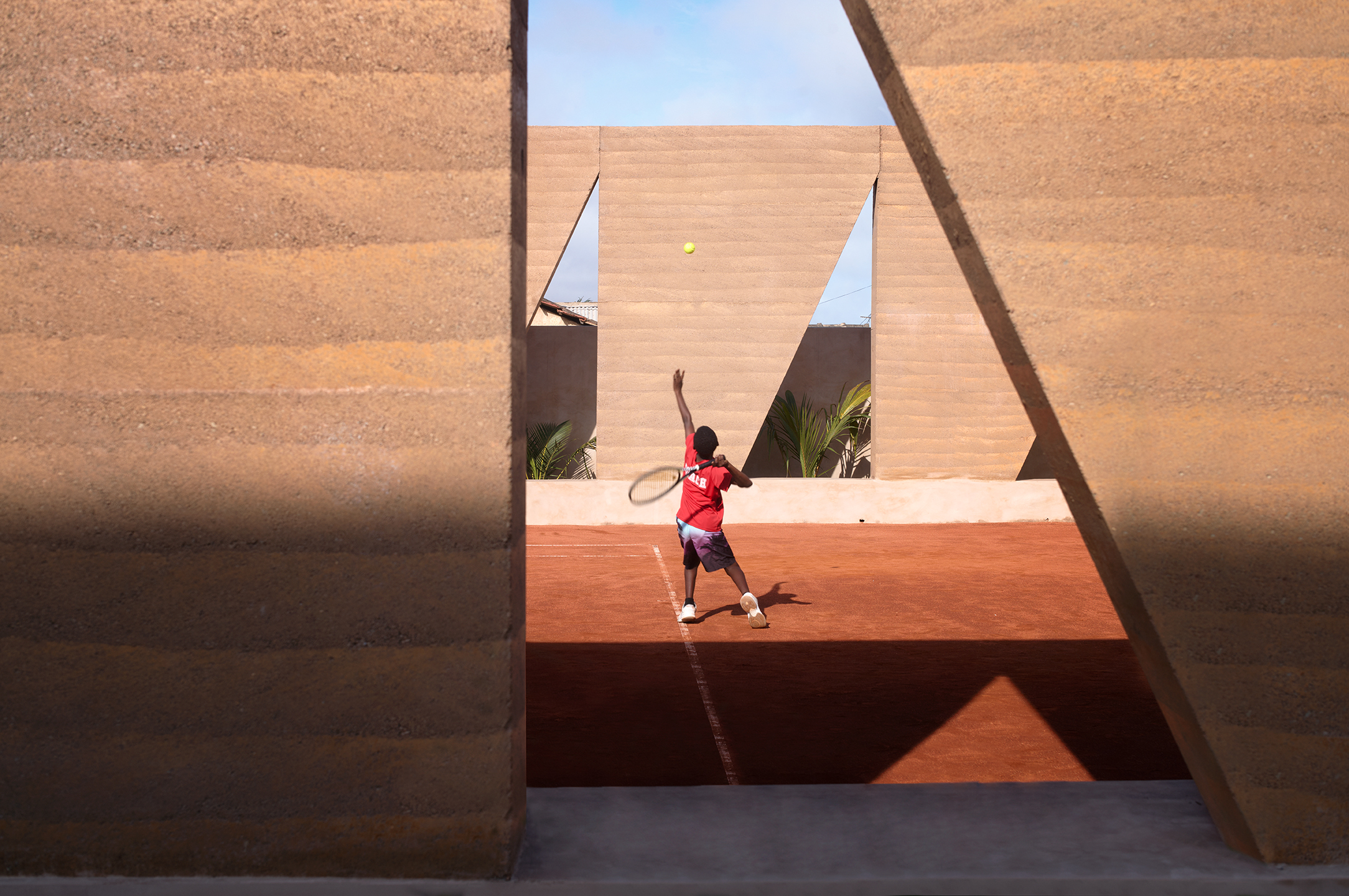 Backyard Community Club, Accra by DeRoche Projects, a sculptural tennis court