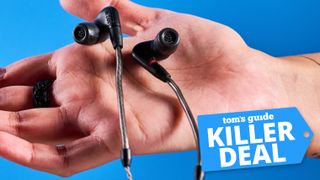Sennheiser IE 200 wired earbuds in the palm of a hand