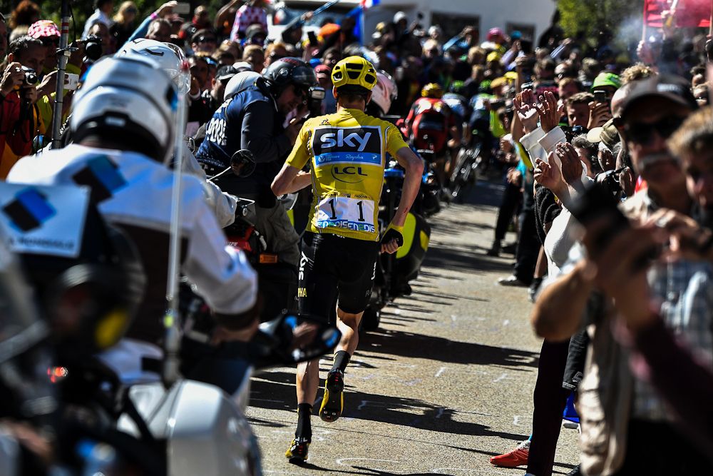 Chris Froome runs for the line during stage 12 of the Tour de France