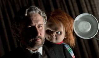 Cult of Chucky Dr. Foley being approached by Chucky from behind