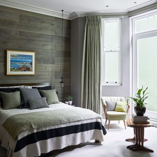 guest bedroom with wooden walls