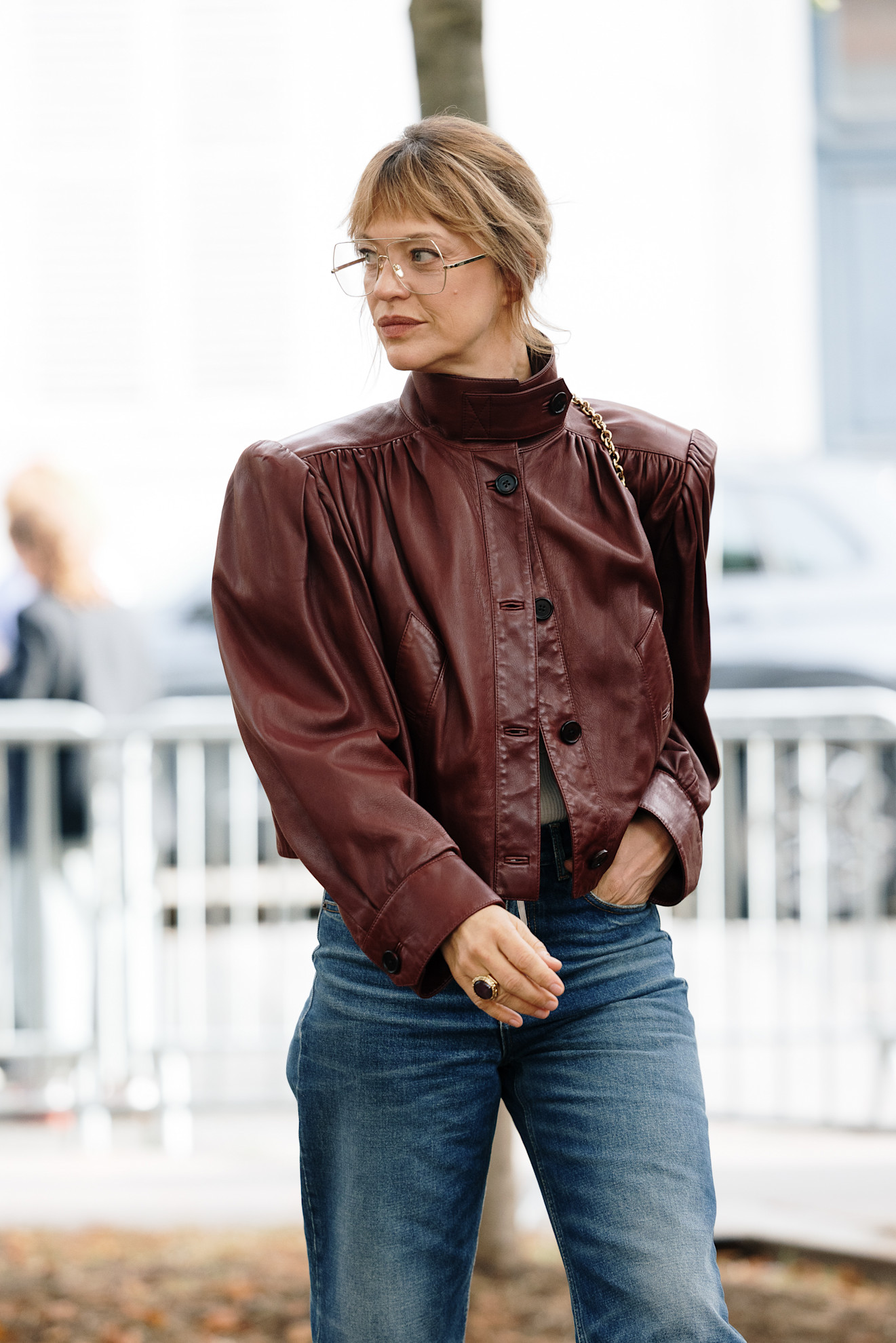 woman wearing cropped leather jacket and jeans