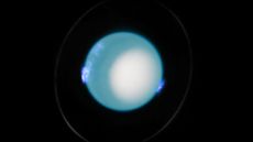 an image of Uranus with blue auroras visible around its surface