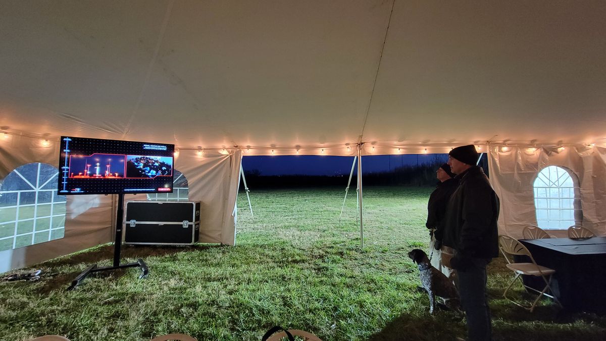 Storm the security dog inside the NASA Wallops Flight Facility media tent watching Rocket Lab's launch.