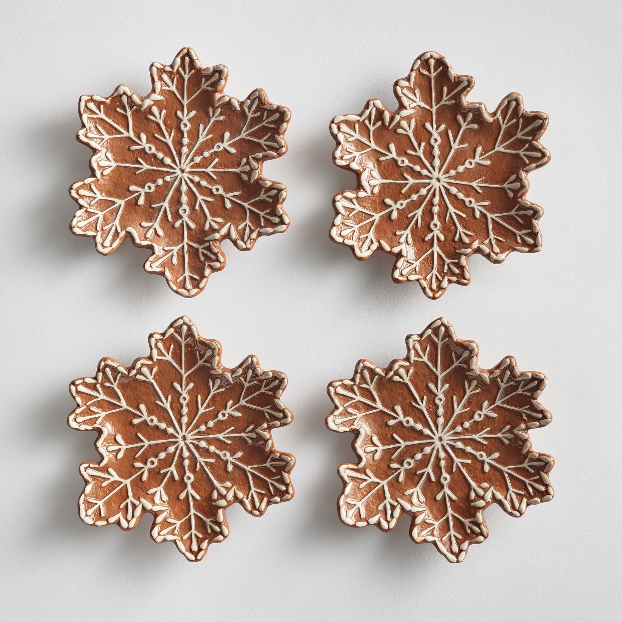 Stoneware appetizer plates in gingebread snowflake design