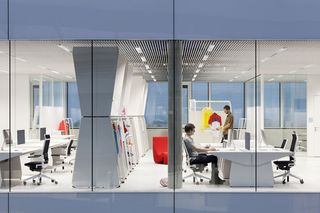 view from the adidas HQ atrium into the office workstations