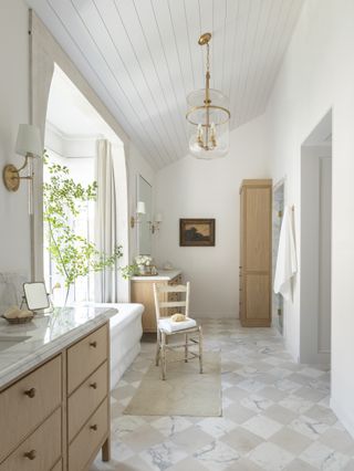 beige bathroom with marble floor tiles