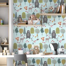 kids room with printed wall and grey chair