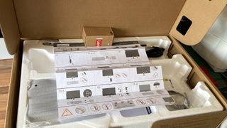 Lenovo L32p-30 32" 4K UHD monitor disassembled in its packaging, a cardboard box with padding