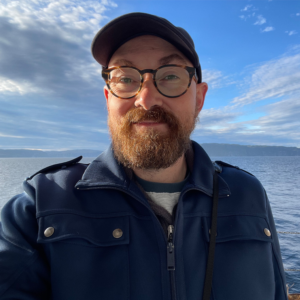 Audubon Society expert Chad Witko in front of water and a blue sky