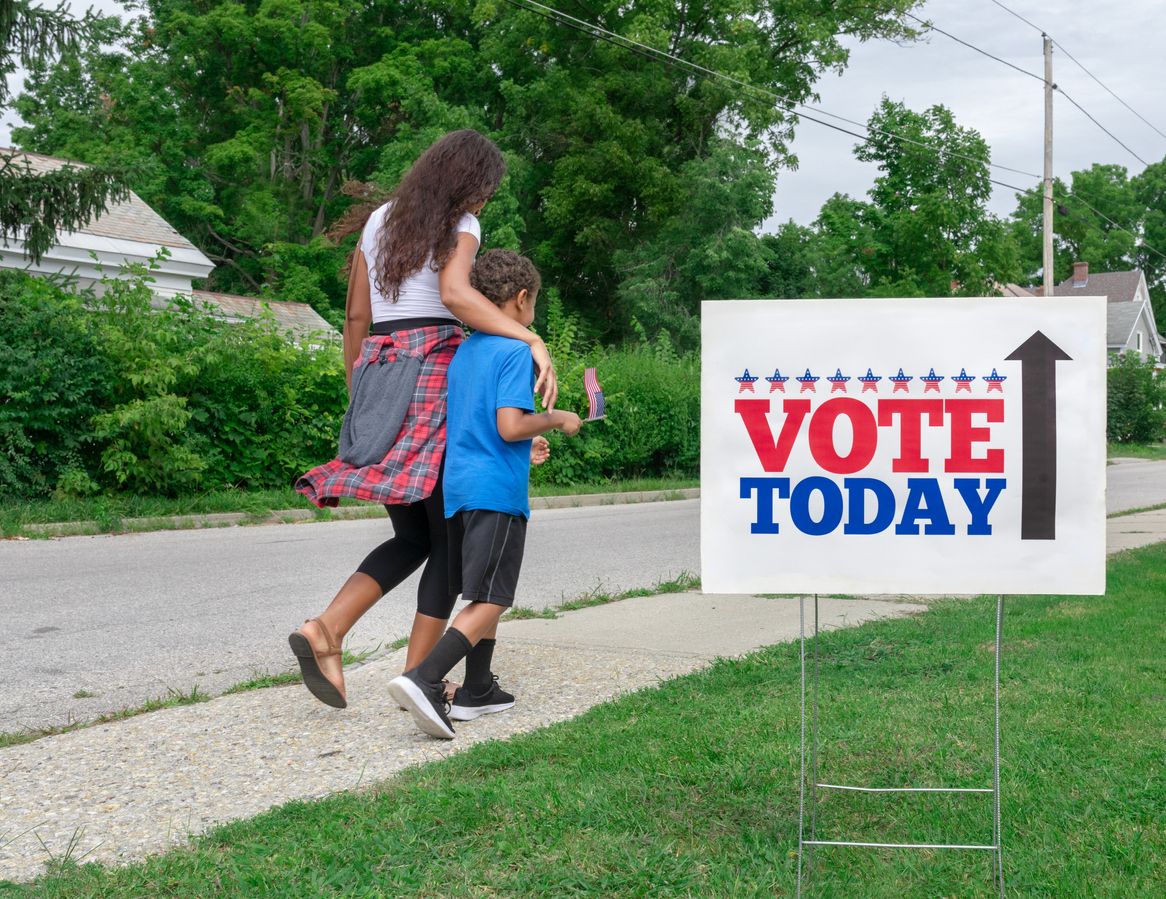 Mother and son walking to polling place