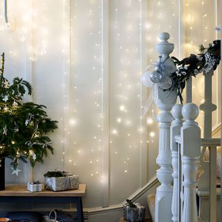 white wall with yellow lights christmas decoration