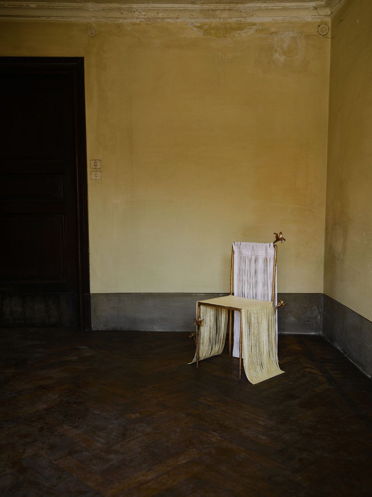 bronze furniture draped in pastel ribbons