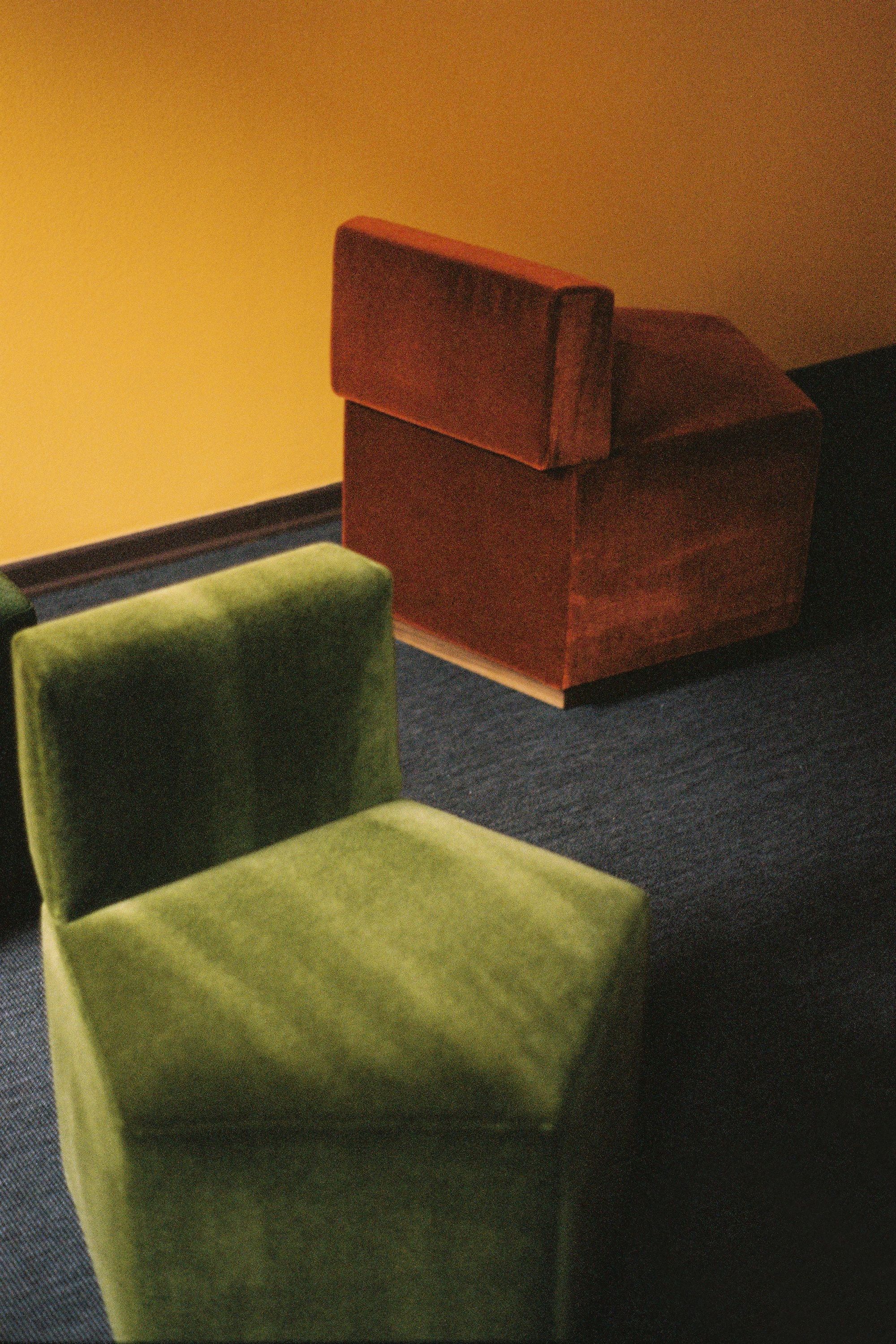 pentagon shaped chairs in bright colors on a bright background