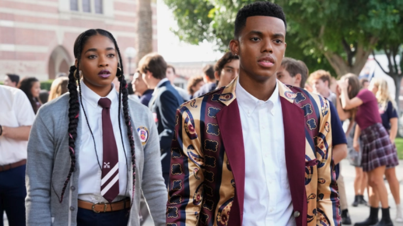 Jabari Banks wearing a shiny burgundy and gold jacket as the fresh prince in Bel-Air season 2