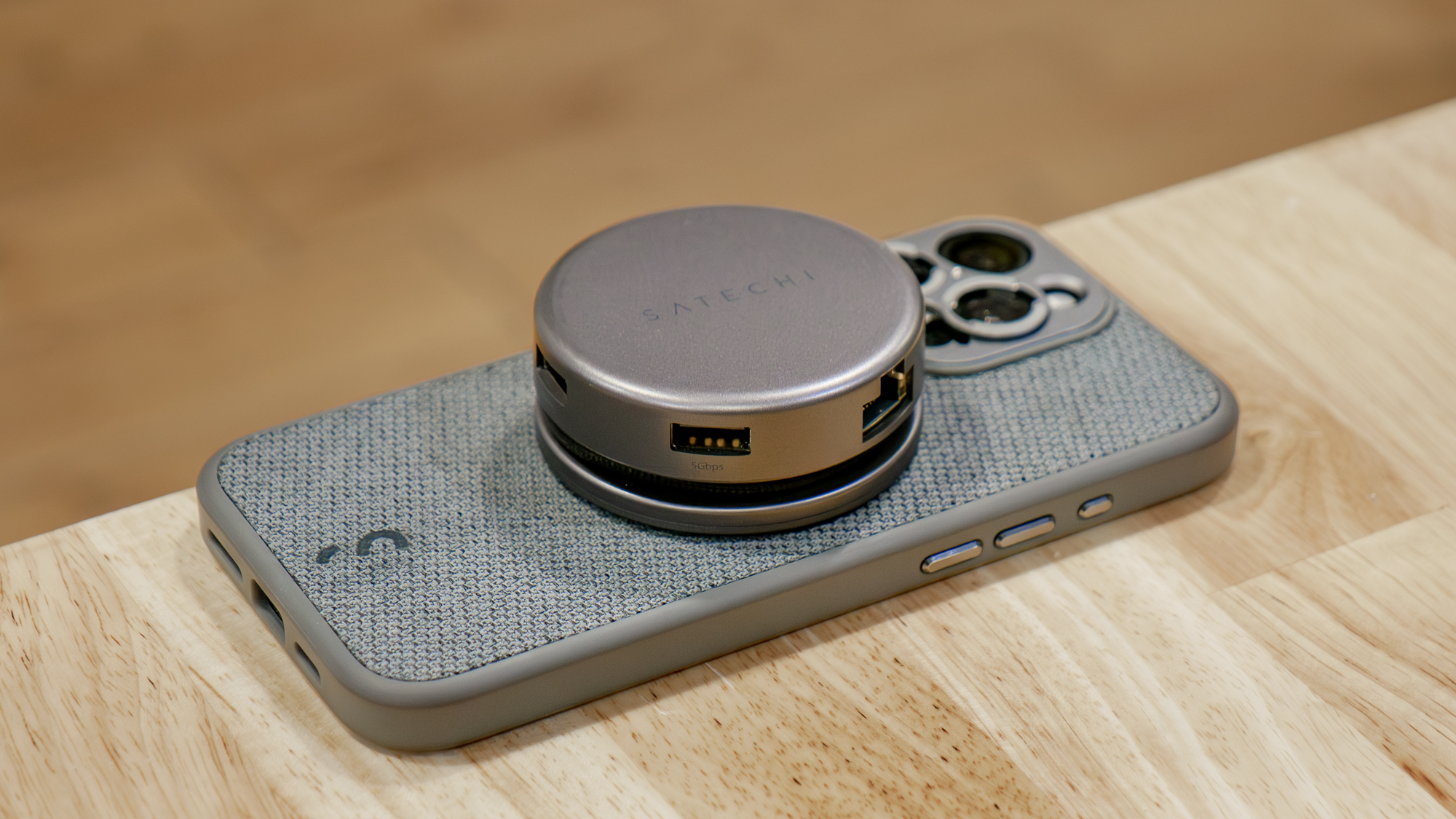 Satechi OntheGo 7-in-1 Multiport Adapter connected to iPhone.