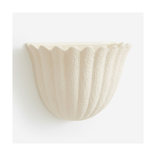 A fluted stoneware wall planter