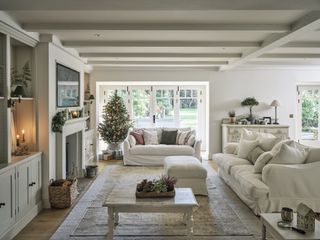 sitting room with cream upholstery and christmas tree