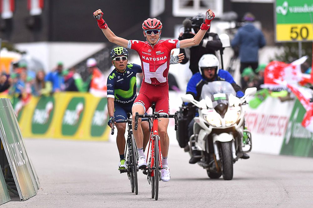 Zakarin celebrates as Quintana protests at the end of stage 4 at the Tour de Romandie.