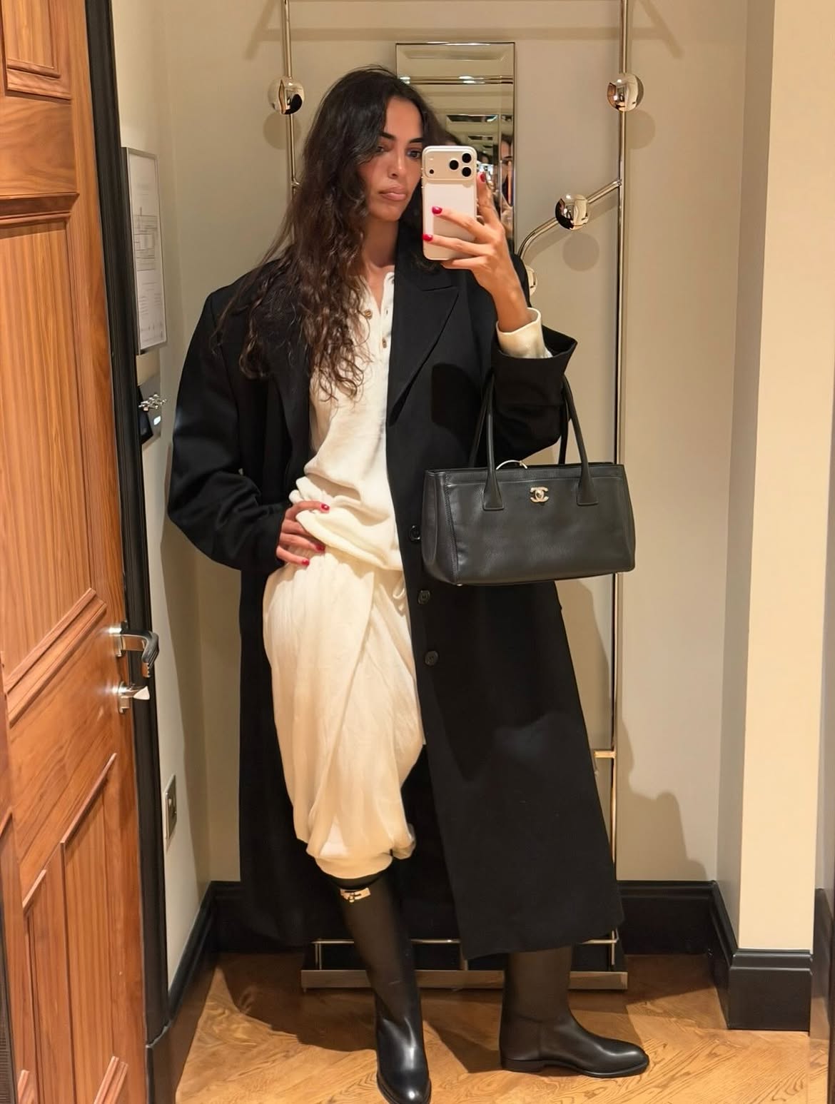 Chanel shopping bag on Sandra Shehab
