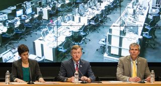 Rachel Kraft, NASA public affairs officer, left, Frank Culbertson, Executive Vice President and General Manager of Advanced Program Group at Orbital Sciences Corp., center, Bill Wrobel, director of NASA's Wallops Flight Facility, right, take questions fro